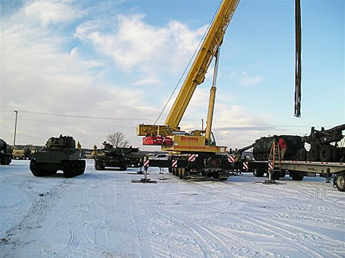 Photo of crane with snow on the ground