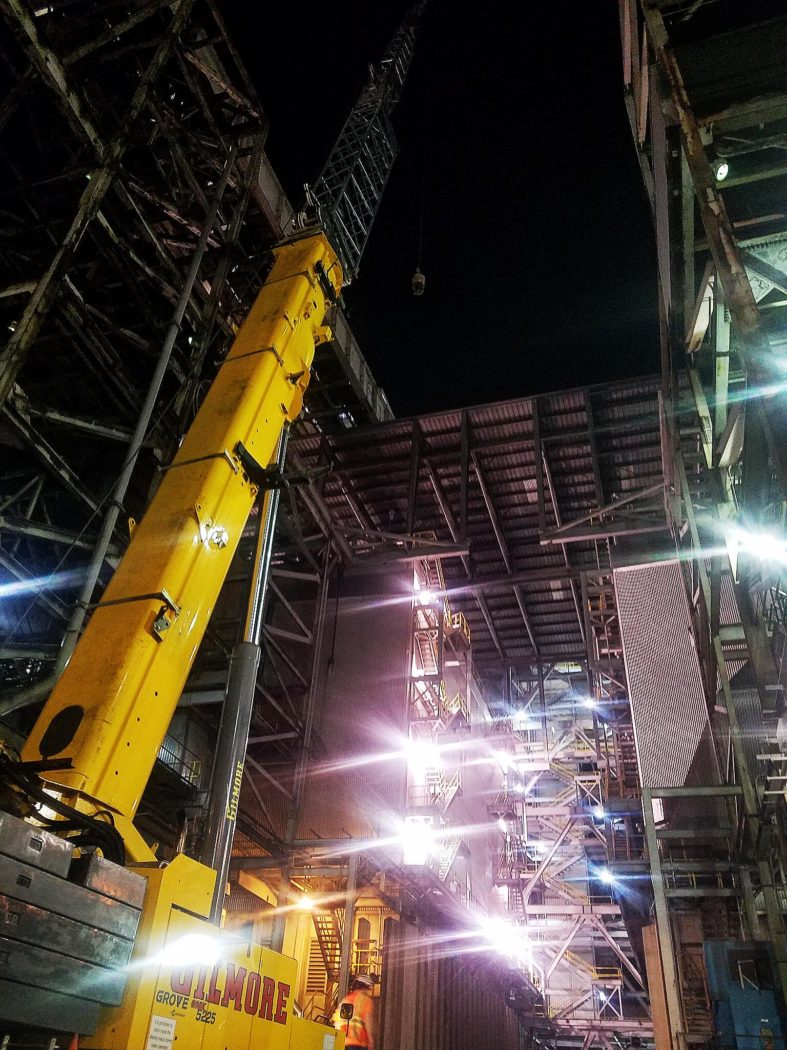 Photo of crane working at night