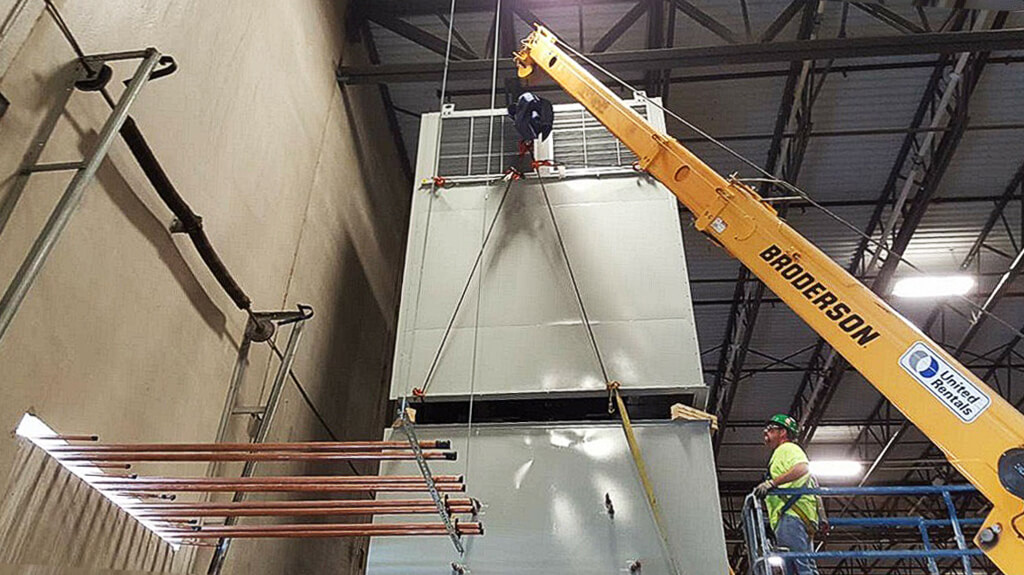 Photo of crane lifting large airconditioner
