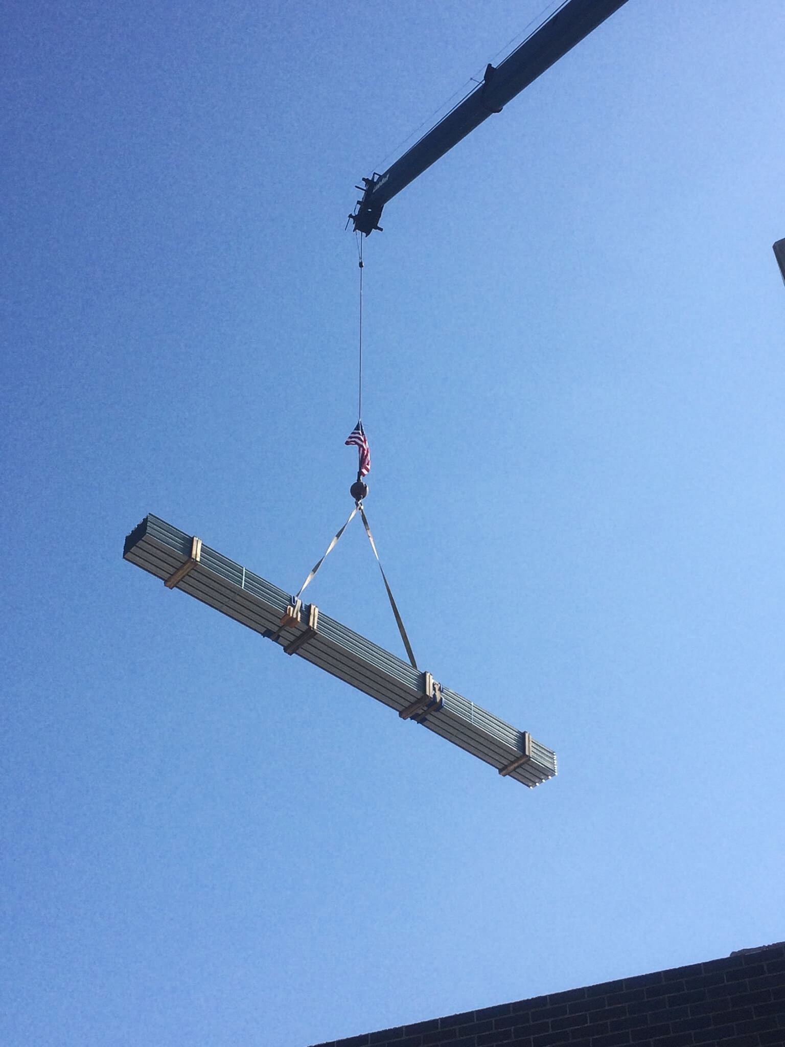 Photo of crane holding scaffolding